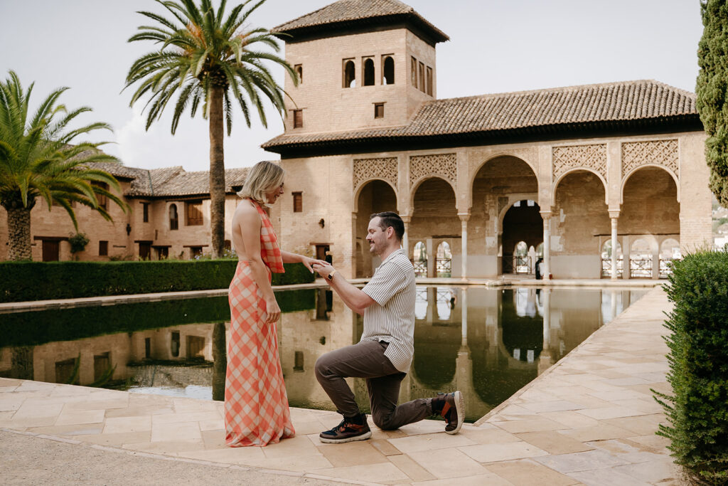 Surprise proposal on one knee at the Partal, Alhambra, Granada