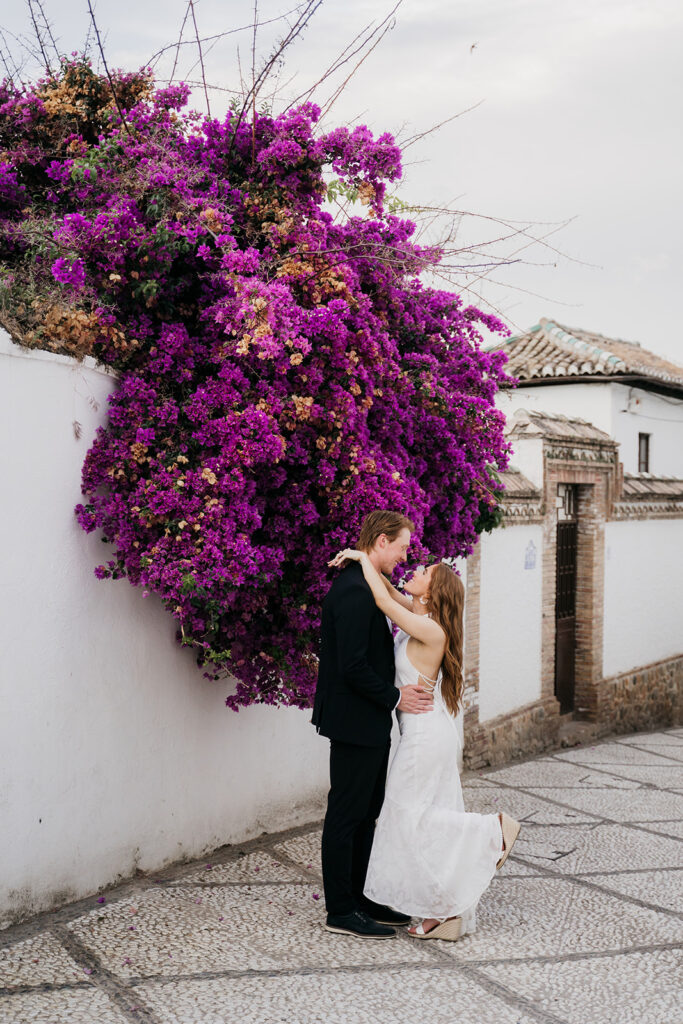 Couple under the bougainvillea in the Albaicín, Granada